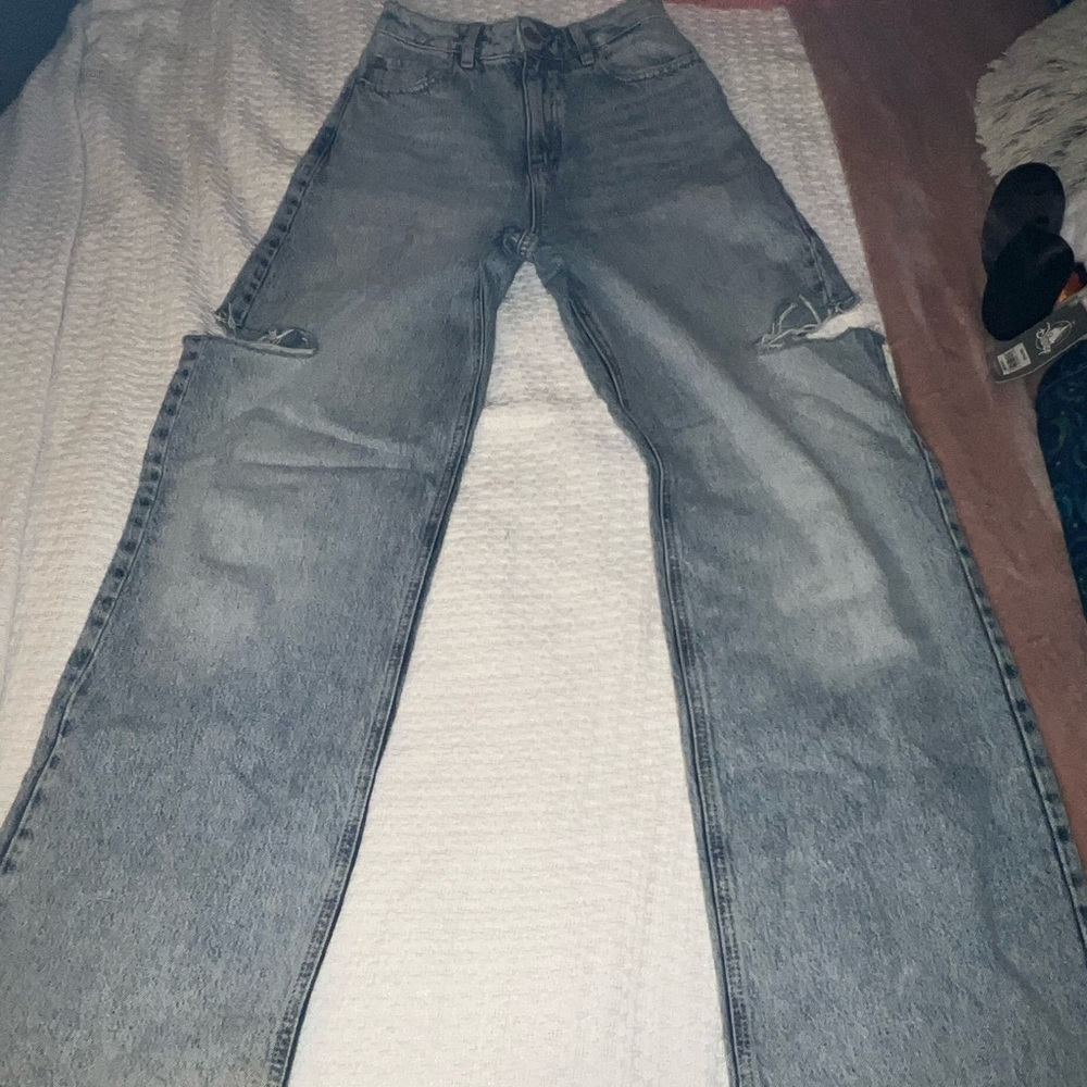 Garage jeans :style wide leg :size 0 waist 24 :holes on sides near knees.